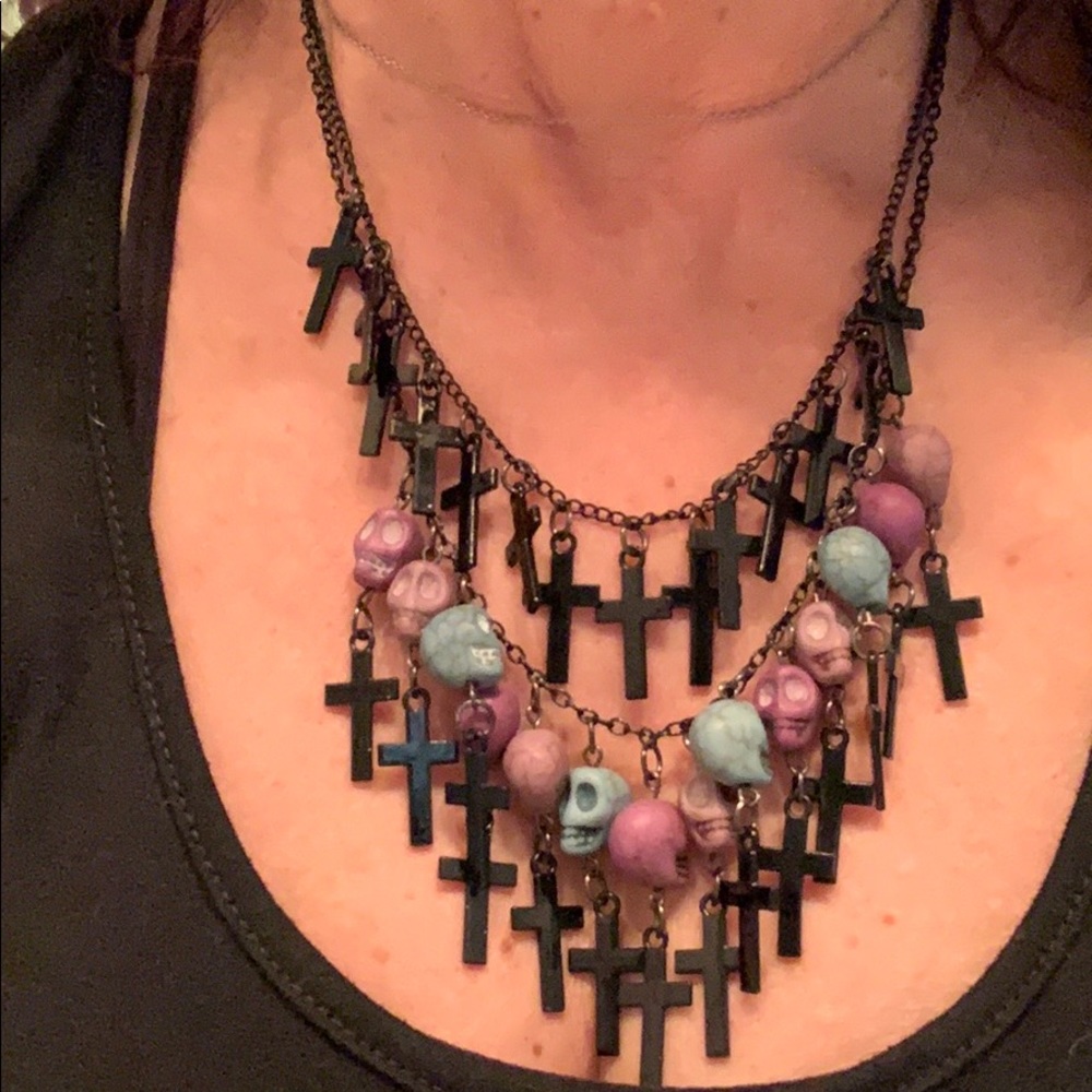 Skeletons and crosses neck.